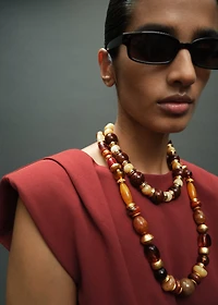 Ruched blouse with shoulder pads