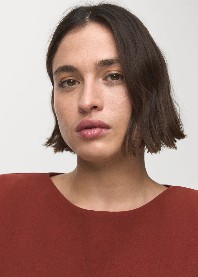 Ruched blouse with shoulder pads