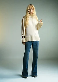Turtleneck sweater with slits