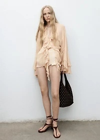 Ruffled blouse with flared sleeves