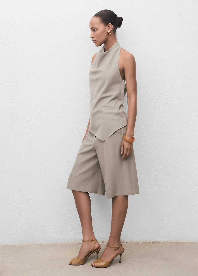 Asymmetrical open-back top