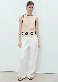 Crochet top with floral finishes