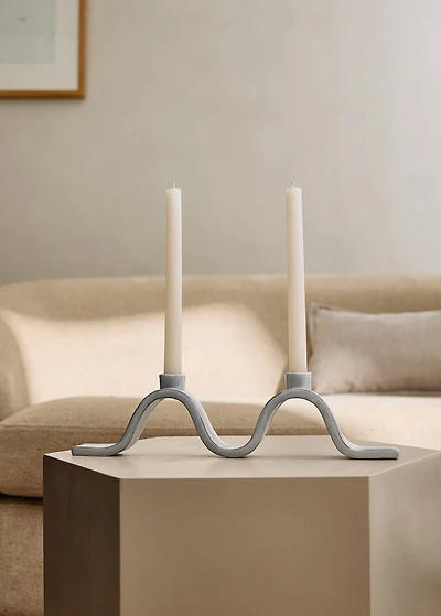 Stoneware candlestick with wave design and glossy finish