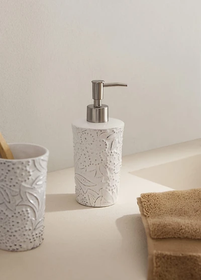 Embossed soap dispenser