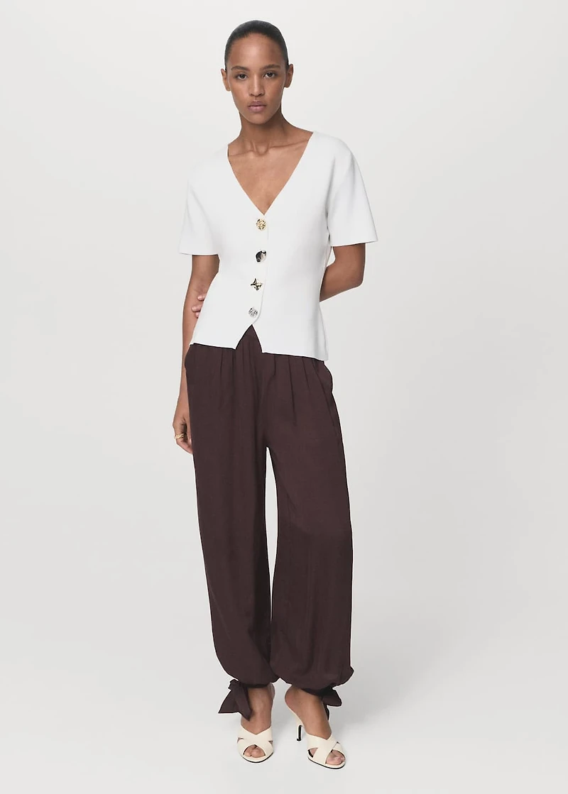 Knitted cardigan with jewel button