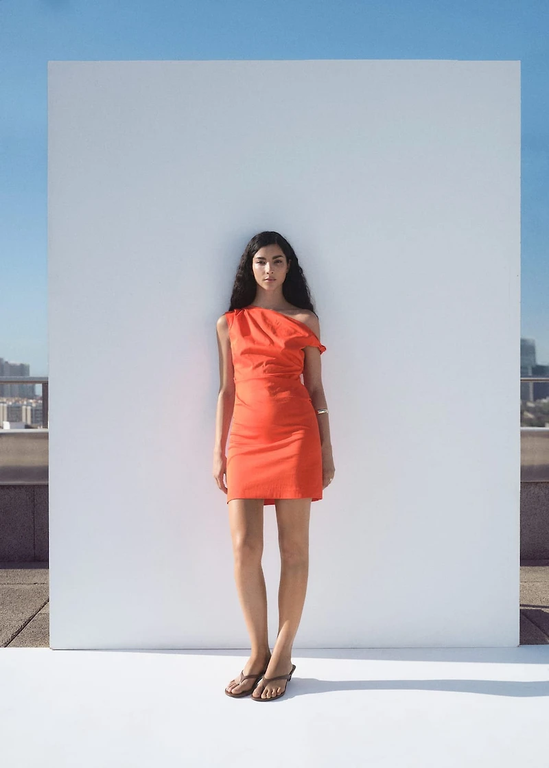 Short dress with asymmetrical neckline