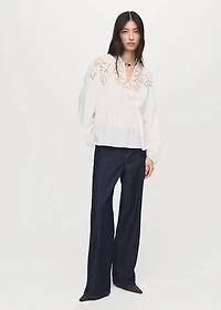 Embroidered blouse with bows