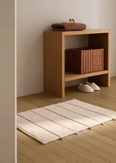 Striped bath mat with fringe detail