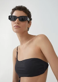 Swimsuit with asymmetrical opening