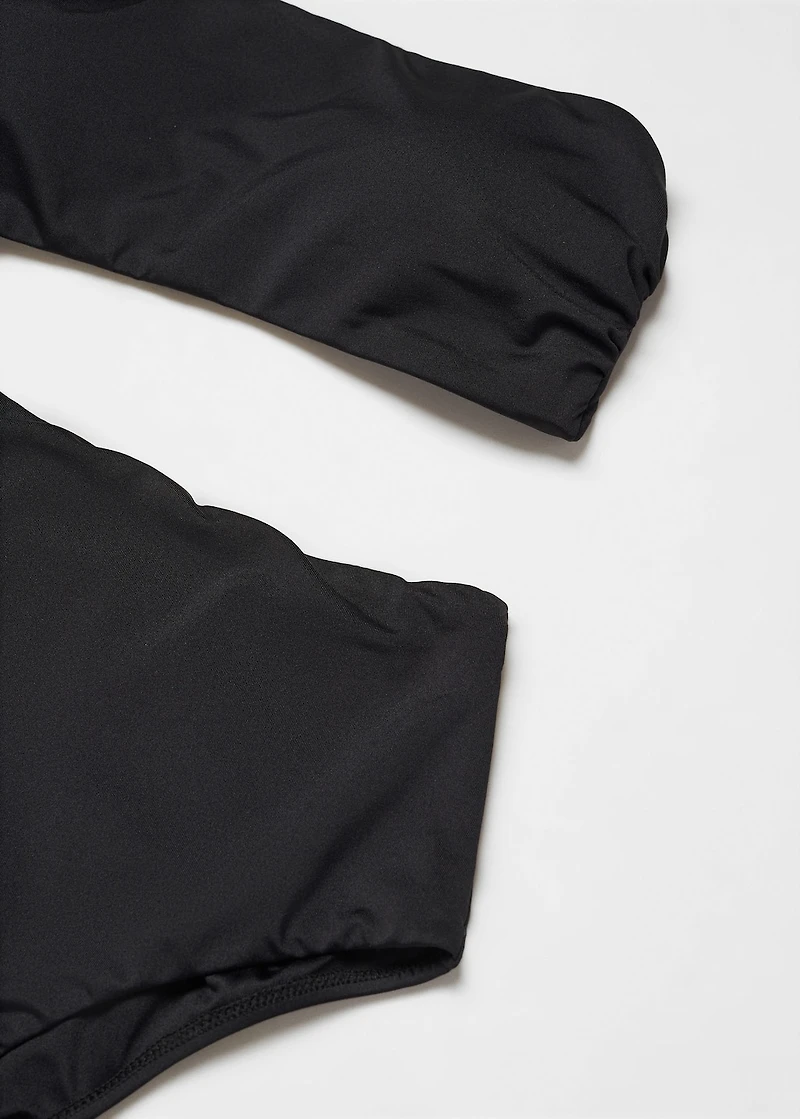 Swimsuit with asymmetrical opening