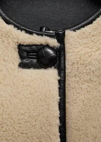 Fur-effect coat with appliqués
