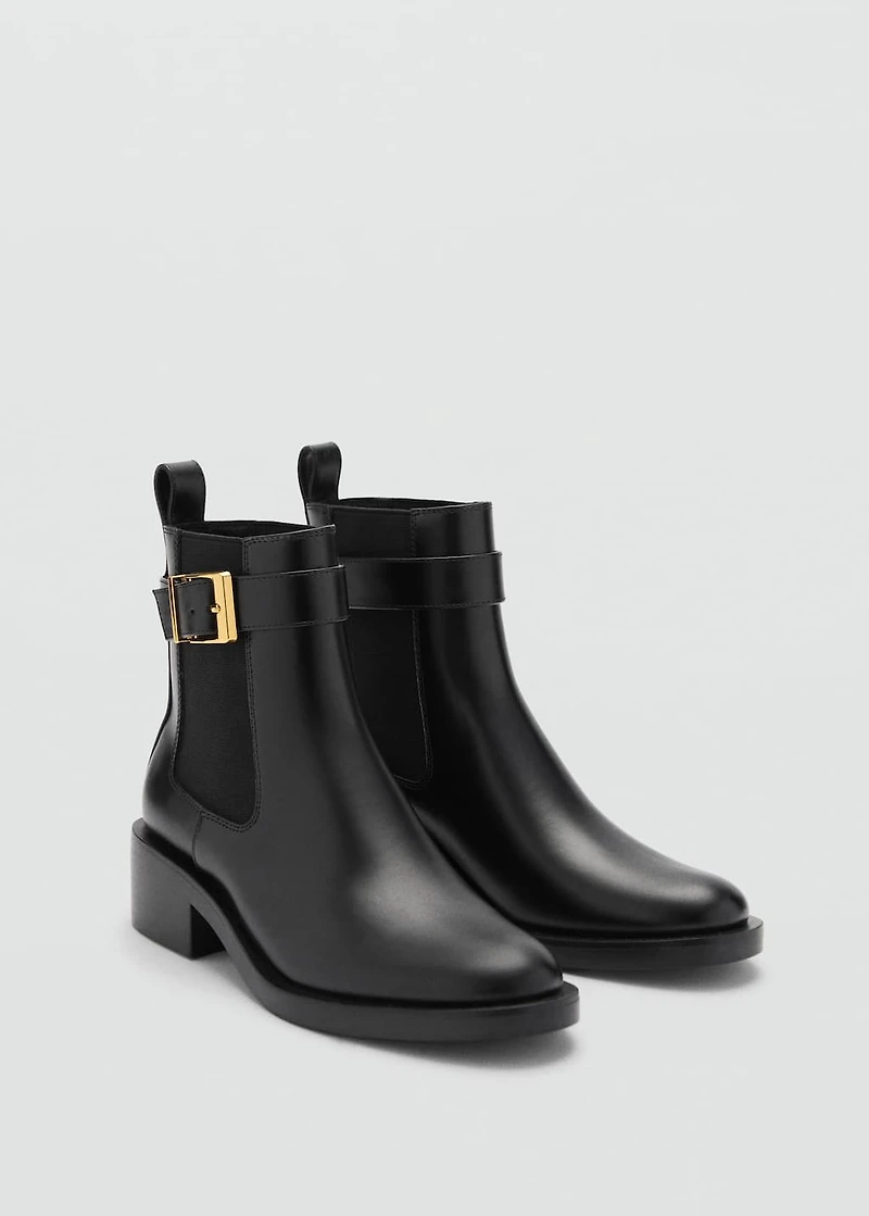 Ankle boots with elastic panel and buckle
