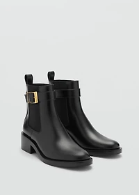 Ankle boots with elastic panel and buckle