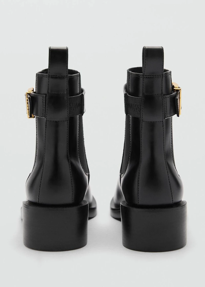 Ankle boots with elastic panel and buckle