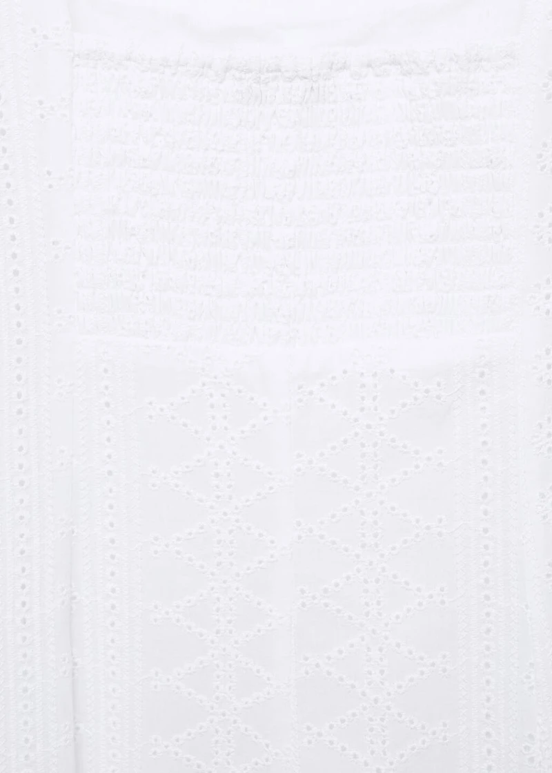 Embroidered dress with puffed hem