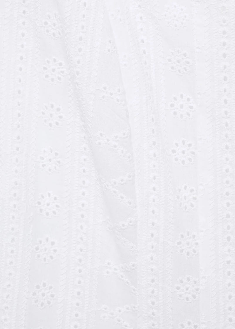 Embroidered dress with puffed hem