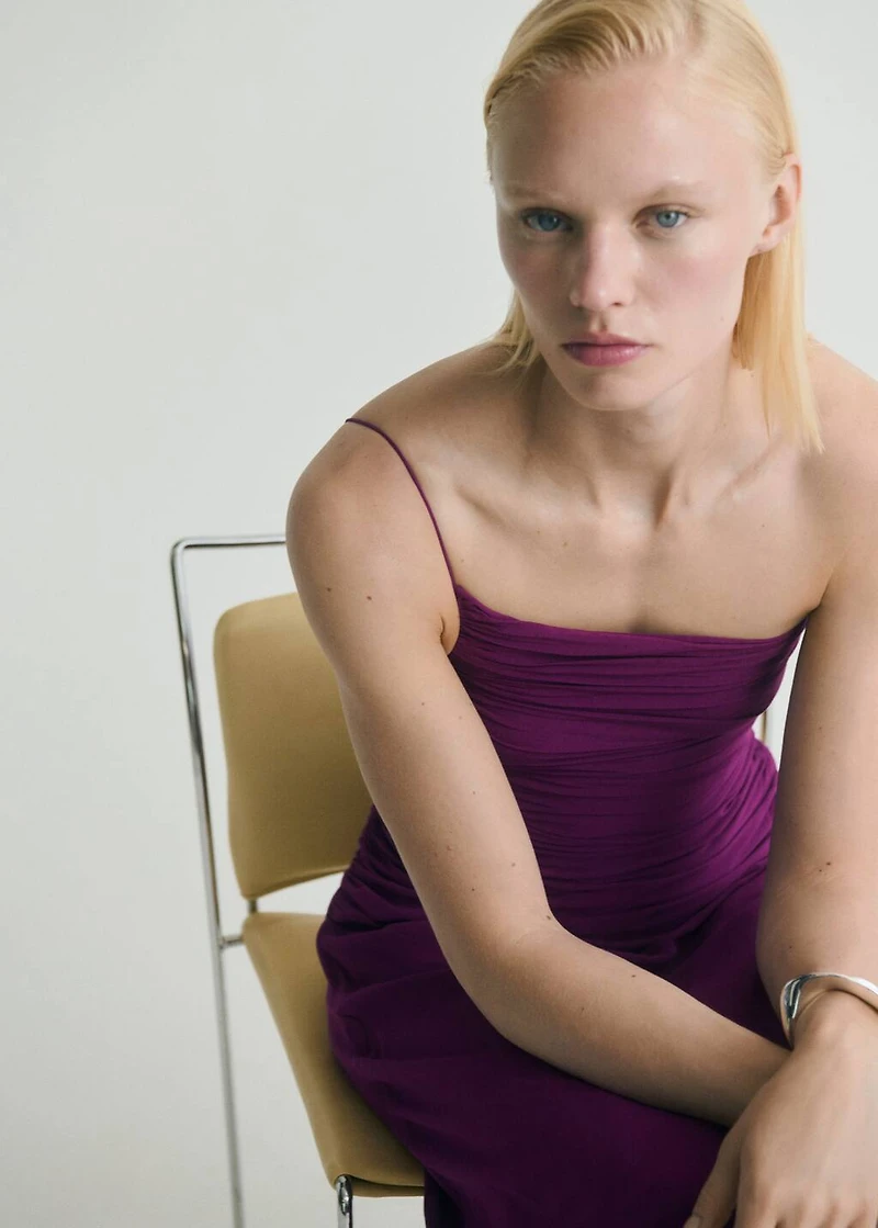 Asymmetrical dress with gathered sides