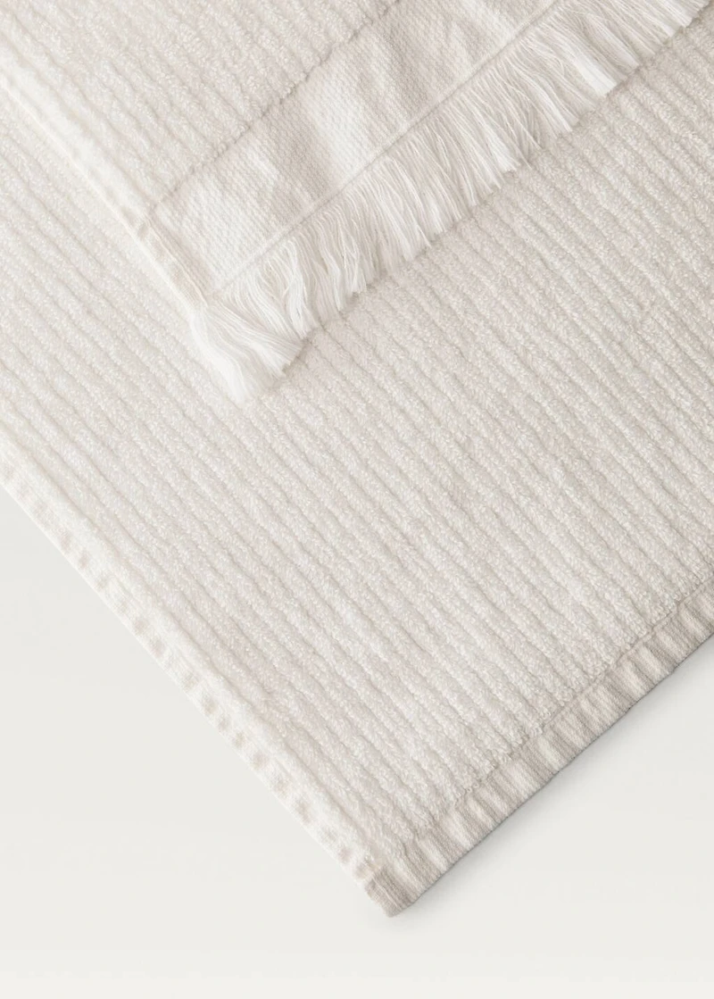 Stripe-embossed washbasin towel with fringes