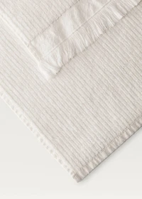 Stripe-embossed washbasin towel with fringes