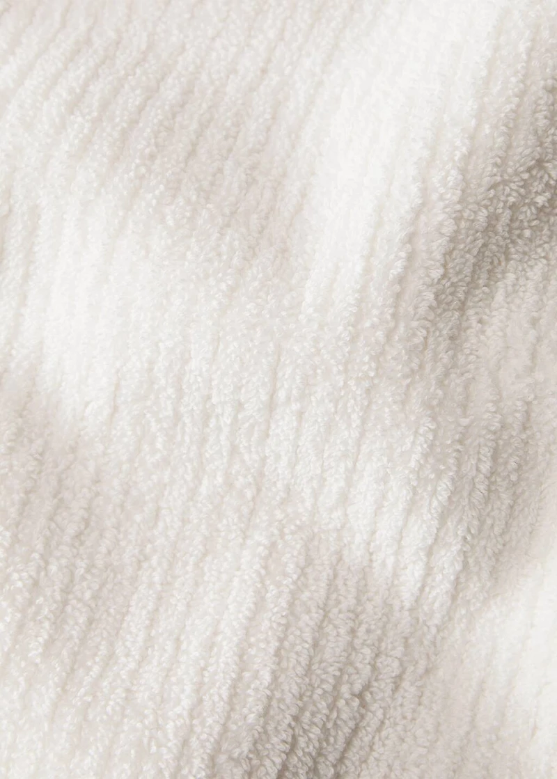 Stripe-embossed washbasin towel with fringes