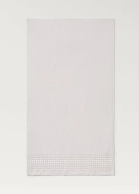 Bath towel with waffle trim and fringe