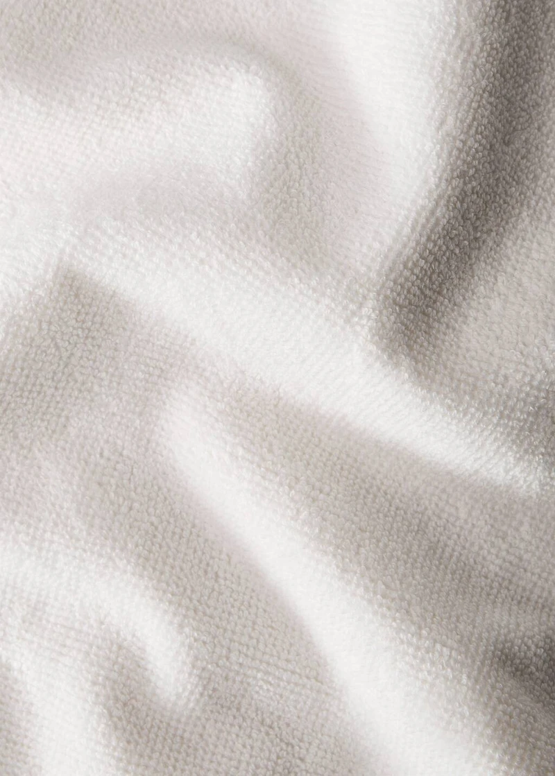 Hand towel with waffle trim and fringe