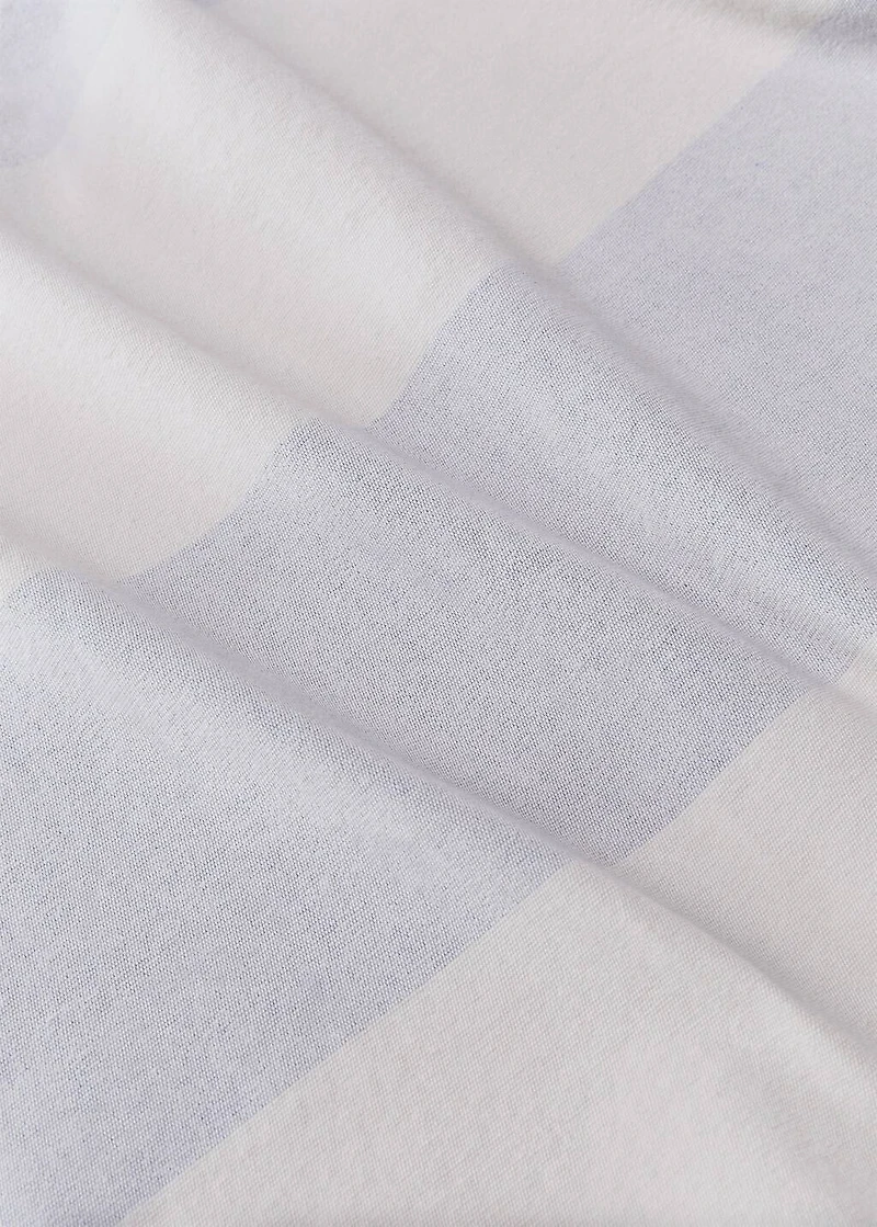 Cotton beach towel with stripes and fringed trim
