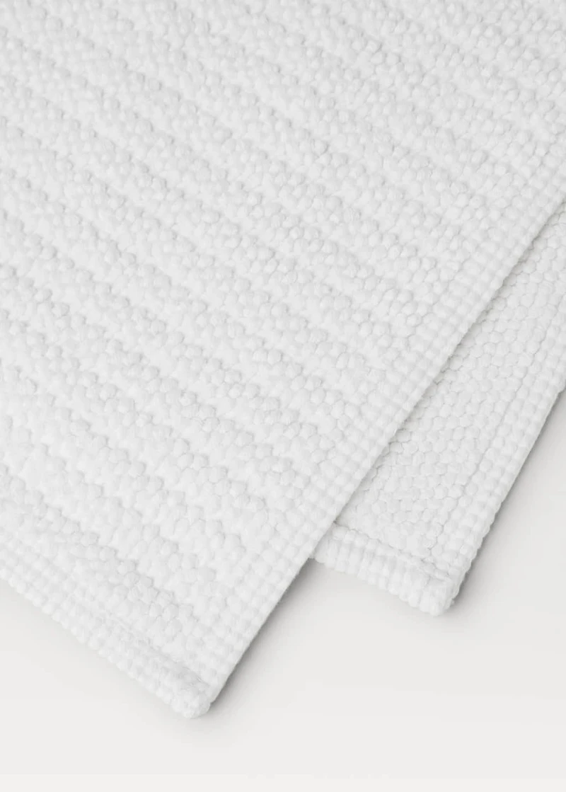 Reversible bath mat