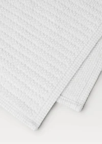 Reversible bath mat