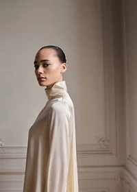 Cape-style silk dress with bow neck