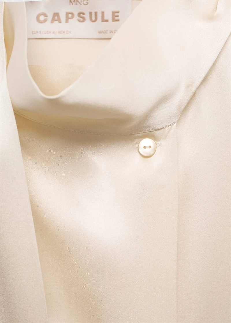 Cape-style silk dress with bow neck
