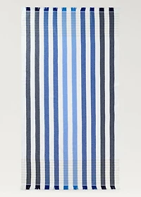 Beach towel with multi-colored stripes and fringes