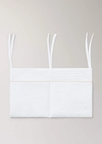Cot organizer with piping