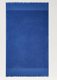 Overdyed terry beach towel with fringes