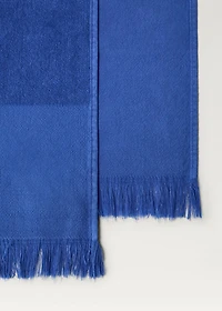 Overdyed terry beach towel with fringes