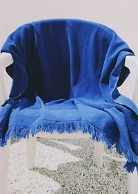 Overdyed terry beach towel with fringes