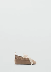 Ballet flats with leather bow