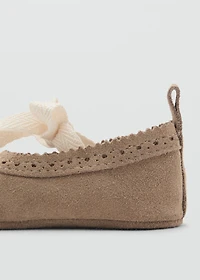 Ballet flats with leather bow