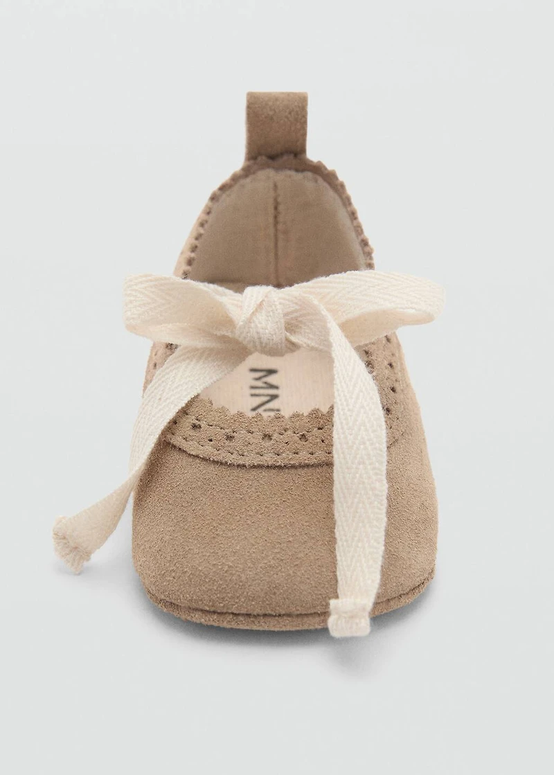 Ballet flats with leather bow