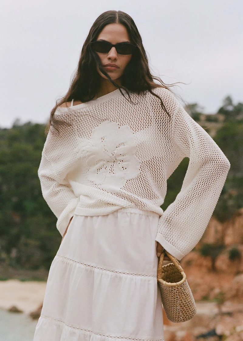 Knitted sweater with flower detail and lace pattern