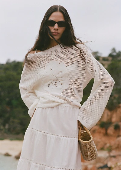Knitted sweater with flower detail and lace pattern