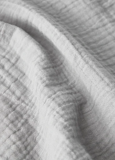 Cotton chiffon fitted sheet with contrast piping for cot
