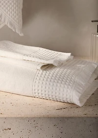 Bath towel with waffle trim and fringe