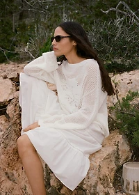 Knitted sweater with flower detail and lace pattern