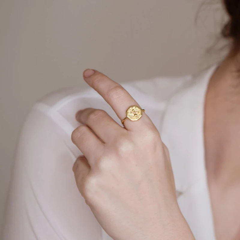 Figure on Coin Ring