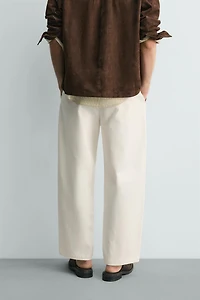 PLEATED WIDE FIT CHINO PANTS