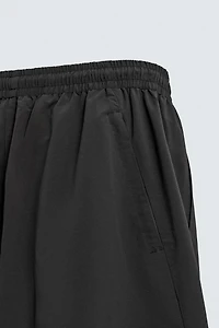 TECHNICAL PANTS WITH STRIPES