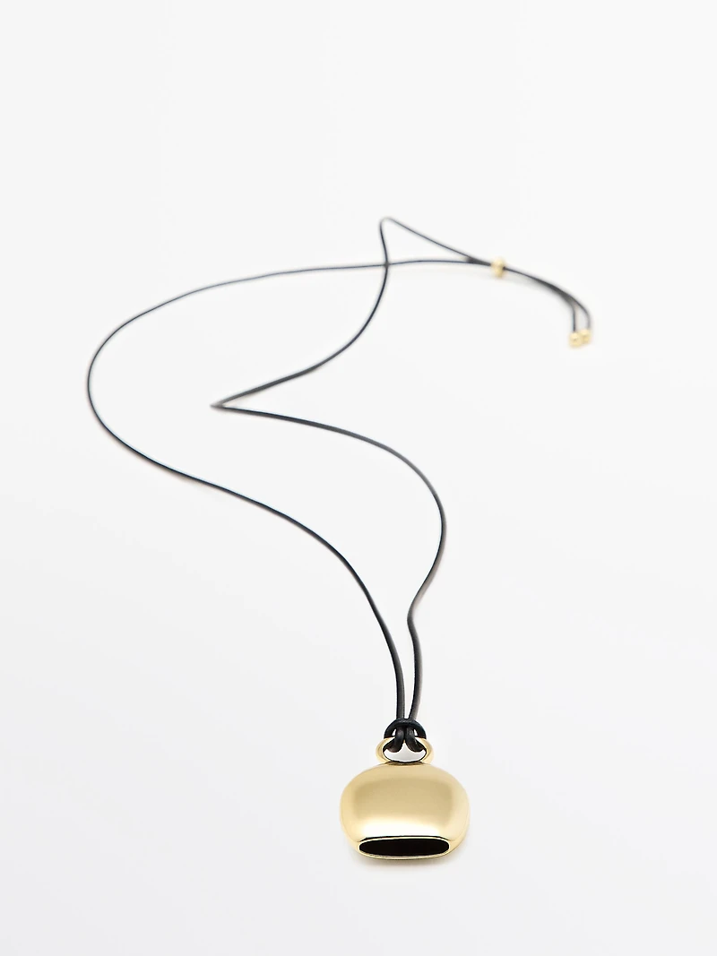 Pendentif pièce dorée