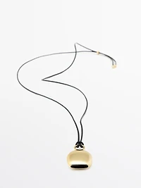 Pendentif pièce dorée