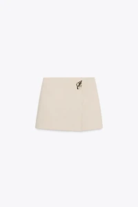 JUPE-PANTALON ASYMÉTRIQUE AVEC APPLIQUE